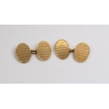 A pair of 18ct gold oval chain cufflinks, machine engraved details, total gross weight approx 16.