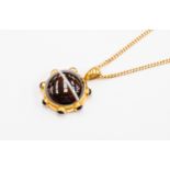 A Victorian banded agate pendant, central agate measuring approx 30mm, set in unmarked yellow metal,