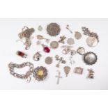 A collection of silver and white metal jewellery to include two Victorian brooches, silver link