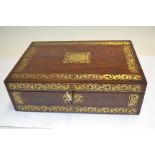 A Regency rosewood writing slope with brass inlay, fitted interior