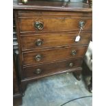 A George III mahogany commode, in the form of a chest of drawers