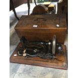 A late Victorian Perba cast iron table top sewing machine, gilded body, fitted in a walnut case, no.
