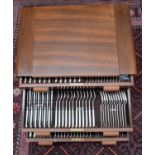 A Mappin and Webb plated Art Deco style canteen of cutlery (12 settings) in wooden drawer cabinet