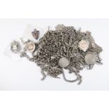 A collection  of nineteen silver fob chains and medallions including Albert and lozenge styles