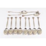 A set of ten Arts and Crafts silver teaspoons in the Art Nouveau style, cast with stylised floral
