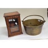 A brass jam pan with an oak smokers cabinet complete with earthenware tobacco jar, Victorian/