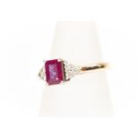 A ruby and diamond ring, comprising central rectangular cut ruby approx. 7mm x 5mm, three