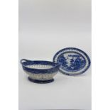 A Staffordshire Pearlware Blue and White Basket and Stand. Printed with Oriental Landscapes. Circa