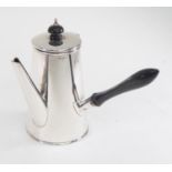A Birmingham 1919, Joseph Gloster Ltd, silver hot water pot with ebonised handle, 8.48 ozt gross