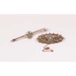 An Edwardian paste set bar brooch, open work detail set to the centre with a blue paste stone with