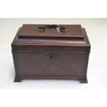 An 18th Century flame mahogany caddy top tea caddy, swing handle, four division interior, pewter