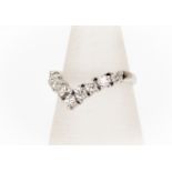 An 18ct white gold diamond ring, claw set, nine round brilliant cut diamonds, approx 0.90ct total