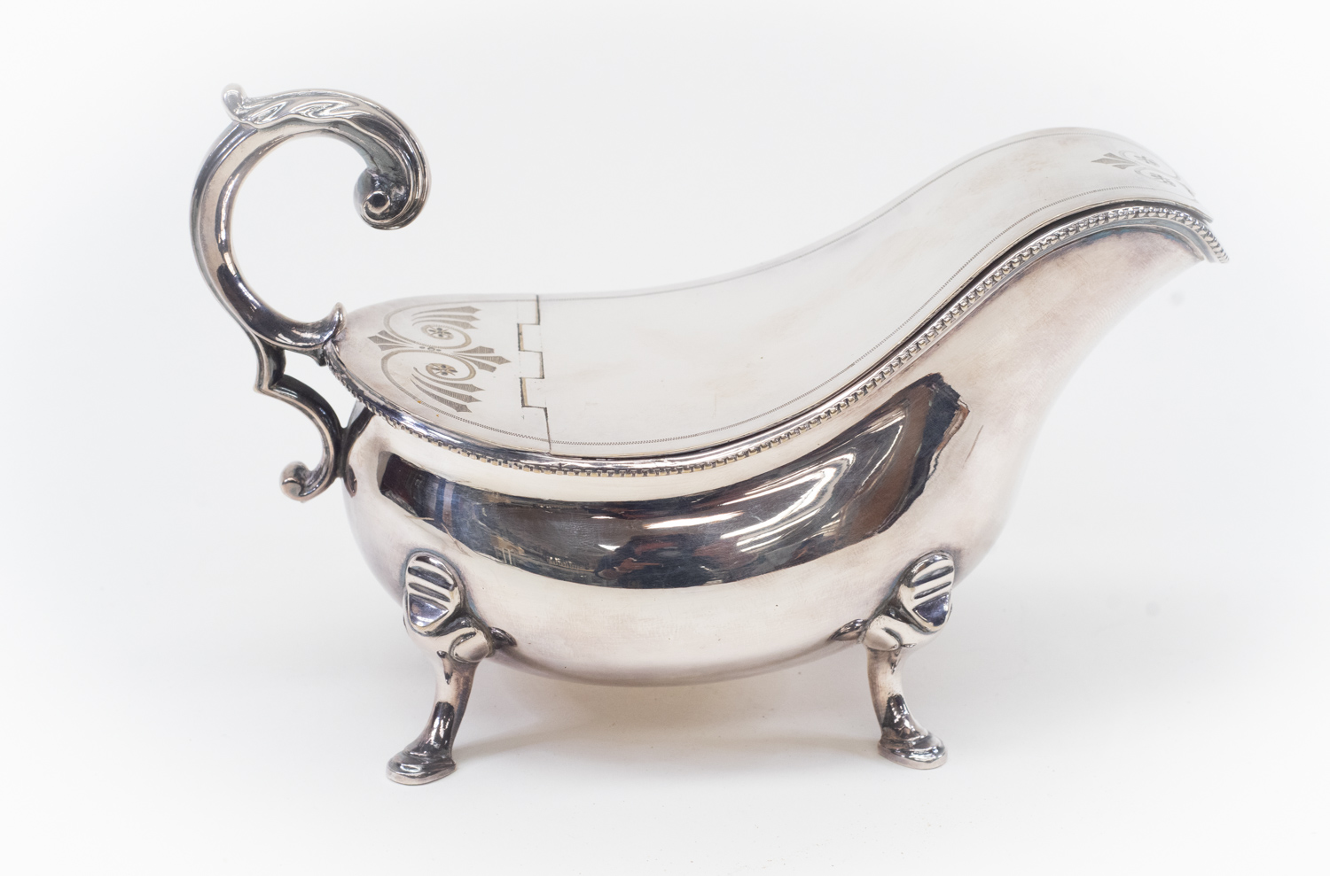 A silver plated spoon warmer