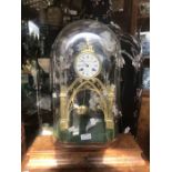 A late Victorian brass skeleton clock in dome, made in Paris, in the shape of Church window, 8 day