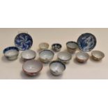 A collection of Asian porcelain tea bowls, Imari and other patterns, including two saucers (13)