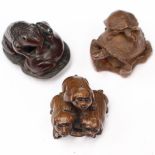Three Japanese carved animal netsukes - one with two toads on lily pad (iron wood); one with three