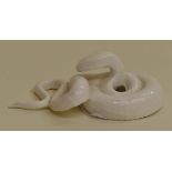 A unmarked Royal Worcester netsuke modelled as a coiled snake, made by the factory exclusively for