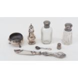 Silver topped glass dressing table bottles, pepper pot, salt, thimble and silver handled butter