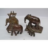 An Indian bronze model of an elephant, rectangular base, 9.5cm long, c.1900; An Indian bronze