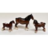 A group of three Beswick bay horses including shire and trotting (3)