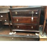 Reproduction Georgian oak small chest of three drawers along with a dark sewing box