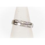 A diamond half set eternity ring, comprising a double row of baguette diamonds set in 10ct white