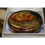 A Fedoskino Pegockuno Russian black lacquered papier mache box, of oval form with detachable lid,