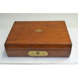 A 19th Century mahogany writing slope, flush brass handle, Bramah lock, fitted interior