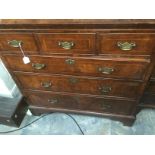 A George I walnut chest of drawers, with three small drawers to top over three long graduated