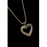 An 18ct gold two tone heart shaped pendant set with six diamonds, together with a snake link 18ct