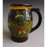 A Royal Doulton Kingsware golfing mug, circa 1930, standard Doulton mark, 14cm  high Condition: chip