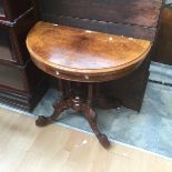 A 19th Century burr walnut demi-lume folding card table, on carved cabriole supports on white