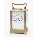A French carriage clock, probably 19th century, with bevelled glass to front, sides, back and top,