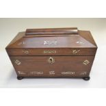 A Regency rosewood tea caddy, of sarcophagus form, mother of pearl inlaid, triple division interior,