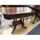 A late Georgian rosewood fold over card table.