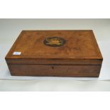 A 19th Century burr walnut writing slope, central floral inlay, parquetry border, fitted interior