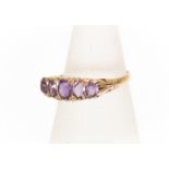 An Victorian style amethyst and 9ct gold ring, comprising five graduated oval amethysts, size P,