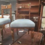 A pair of Victorian oak gothic revival side chairs, blue upholstered.