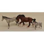 Three Beswick Parian ware horses including trotting horse (bay) and two dapple greys (damages)