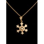 An Edwardian  15ct gold and seed pearl pendant, cross form set with seed pearl decoration, total