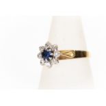 An 18ct gold, sapphire and diamond cluster ring,  with palladium settings, size N, gross weight