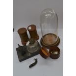 An assorted collection of desk and collectable items including copper and brass, money boxes, and