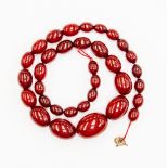 A graduated cherry amber type necklace with rolled gold clasp ( Needs repair ) 57.2 gms Approx