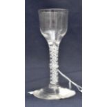 An 18th century opaque twist wine glass, the ogee bowl on a double lattice and double helix core