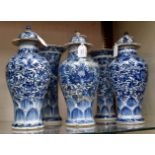 A Chinese export ware matched garniture de cheminée of five blue and white vases, early 18th