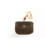An Asian leather purse with ivory netsuke and stone/glass ball