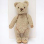 Steiff: A small 20th century Steiff, mohair teddy bear, straw filled, button in left ear, circa ,