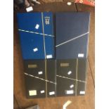 Four black / blue stamp albums, GB QE2 mint issues and sets (Q)