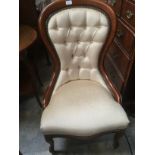 Mahogany and cream upholstered balloon back ladies chair, with button back and studded trim.