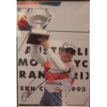 Motoring Interest: A framed, signed and glazed picture of Mick Doohan, frame approx. 39cm x 50cm.